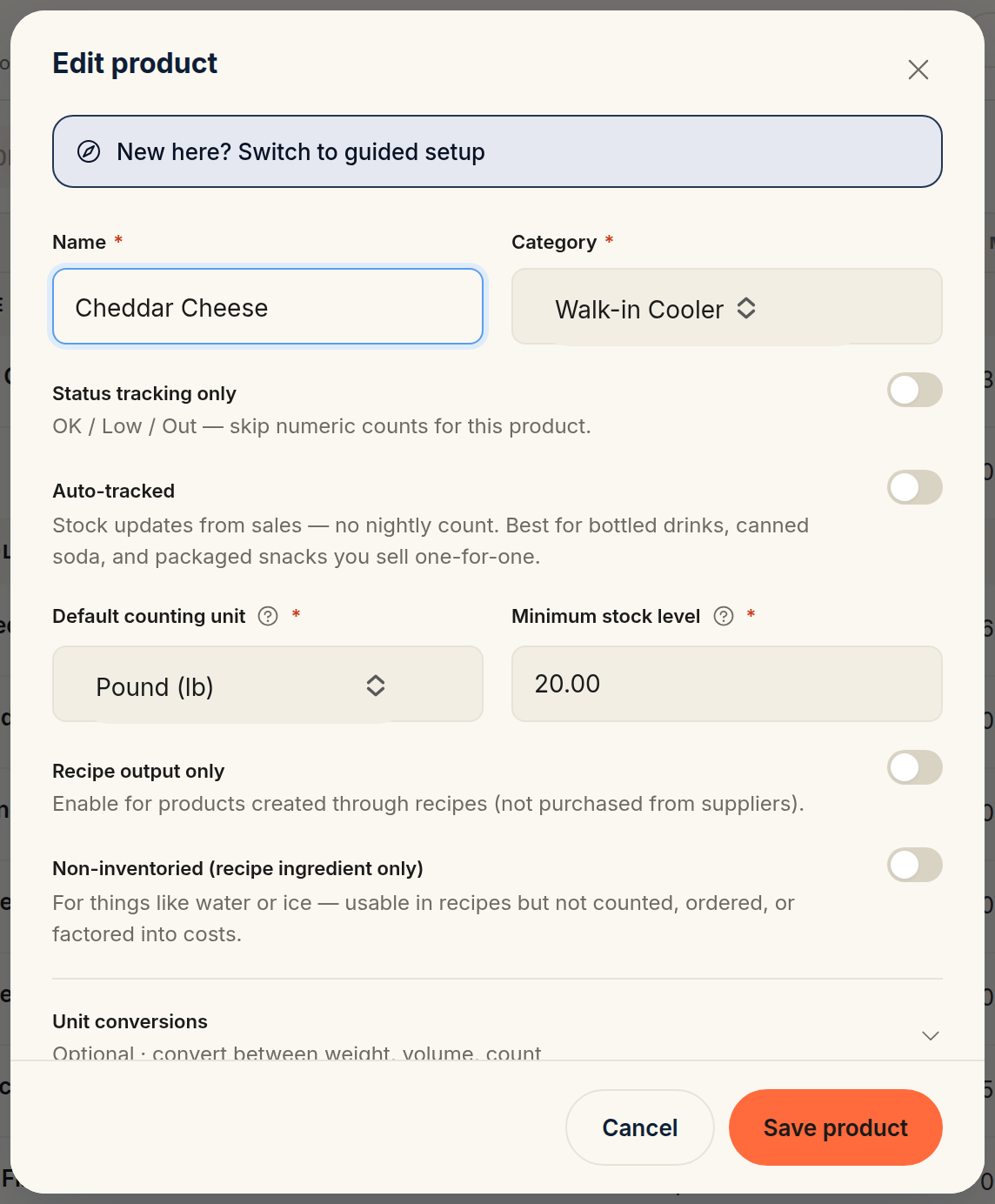 The product quick form, with fields for name, category, default counting unit, and minimum stock level above the status-tracking and auto-tracked toggles