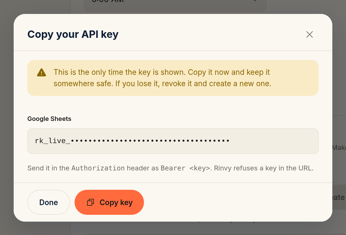 The Copy your API key sheet with a one-time warning, the new key, and the Done and Copy key buttons